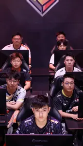 Group Of Gamers Competing Intensely At A Local Esports Tournament