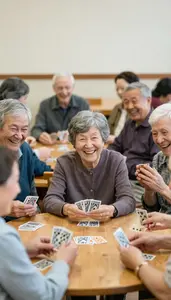 Group Of Seniors Laughing While Playing Cards At A Community Center