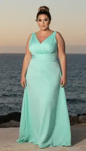 Lebanese Woman In Her Mid 30s With Large And Curvy Figure With Dark Blonde Bun