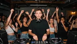 Dj Performing A Set At A Warehouse Party Crowd Dancing Happily