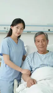 A Supportive Wife Holding Her Husbands Hand In A Hospital Room