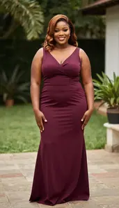 African Woman In Her Late 20s With Large Build Figure With Light Brown Half Up