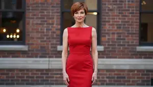 Caucasian Woman In Her 50s With Lean Figure With Auburn Short Pixie Cut Wearing