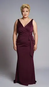 East Asian Woman In Her Late 30s With Fat With Blonde Textured Hair Wearing Wine