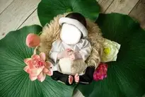 Baby With Flowers And Leaf